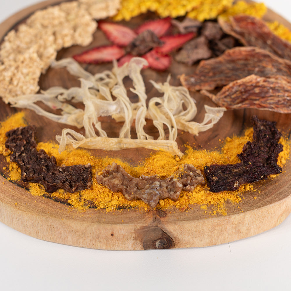 Front view of halloween Barkuterie Board with dog friendly jerky and dog treats.