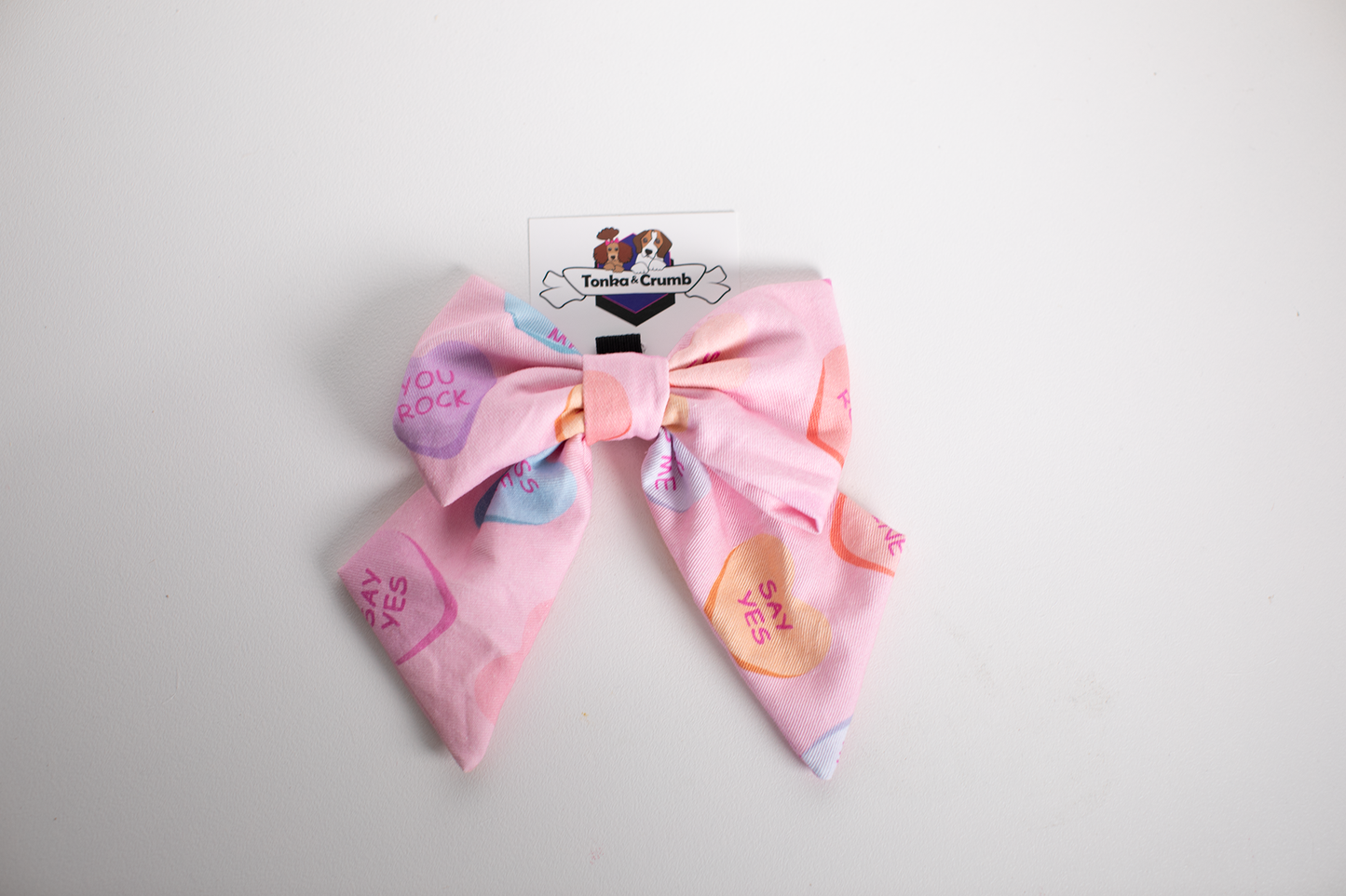 Dog sailor bow in candy heart Valentine's Day