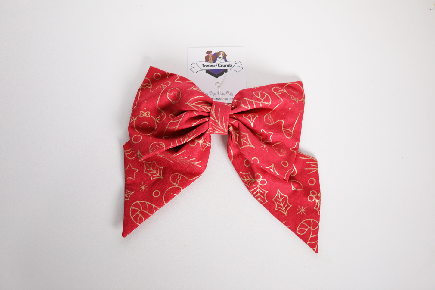 Hair bow with red and gold Christmas theme