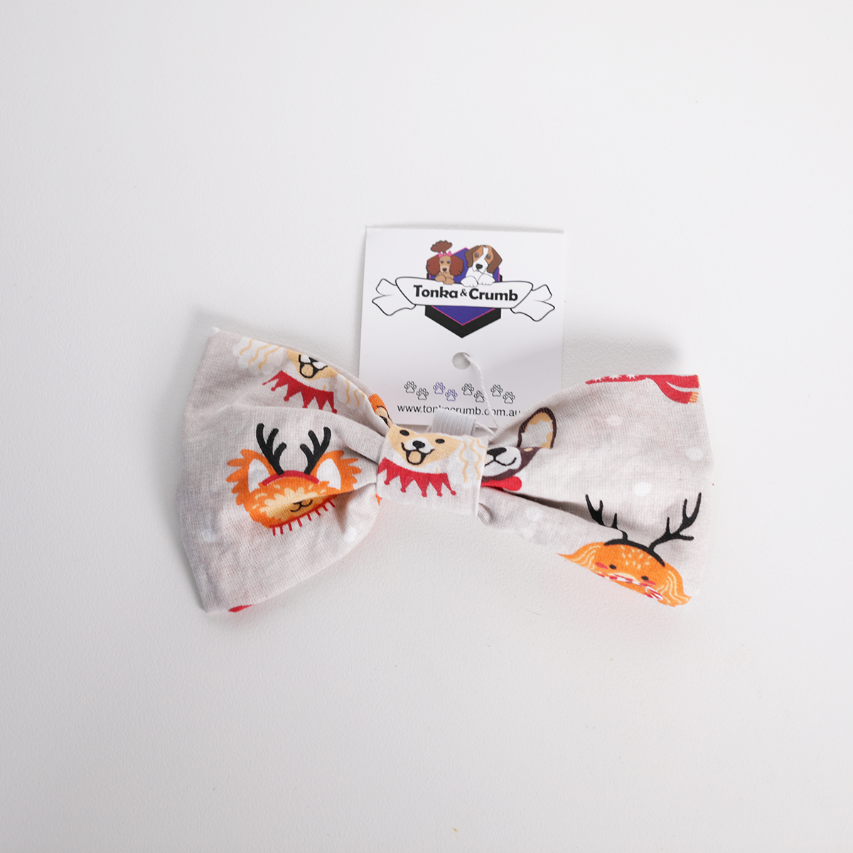 Pet bow tie featuring dog prints