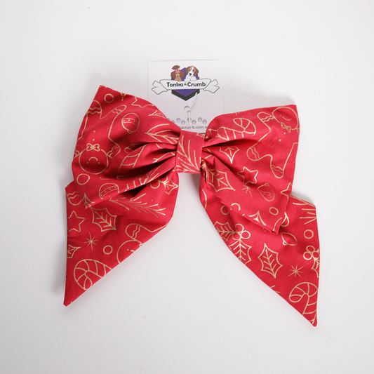 Festive women's hair bow in red and gold