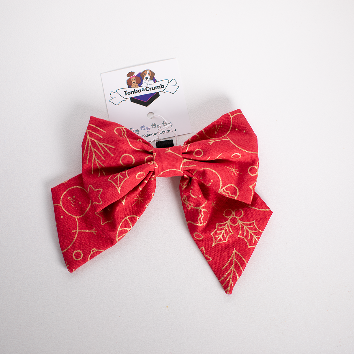 Red bow with festive pattern in gold for Christmas