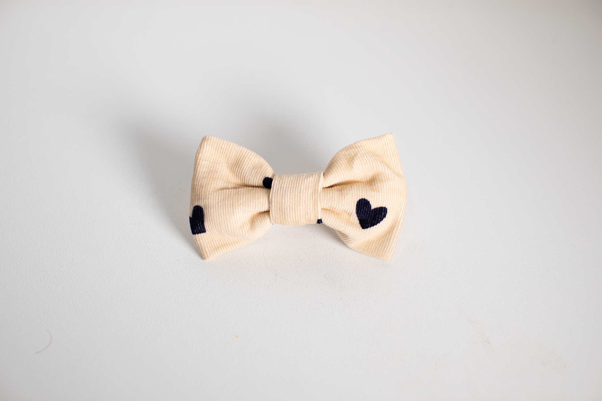 Pet bow tie with navy hearts in corduroy fabric